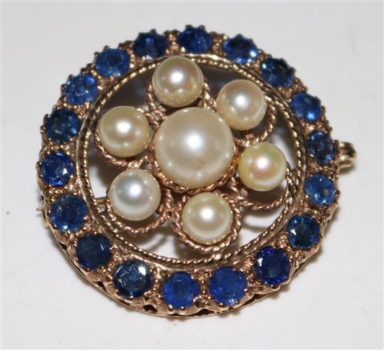 Gold, sapphire and pearl set pierced circle brooch
